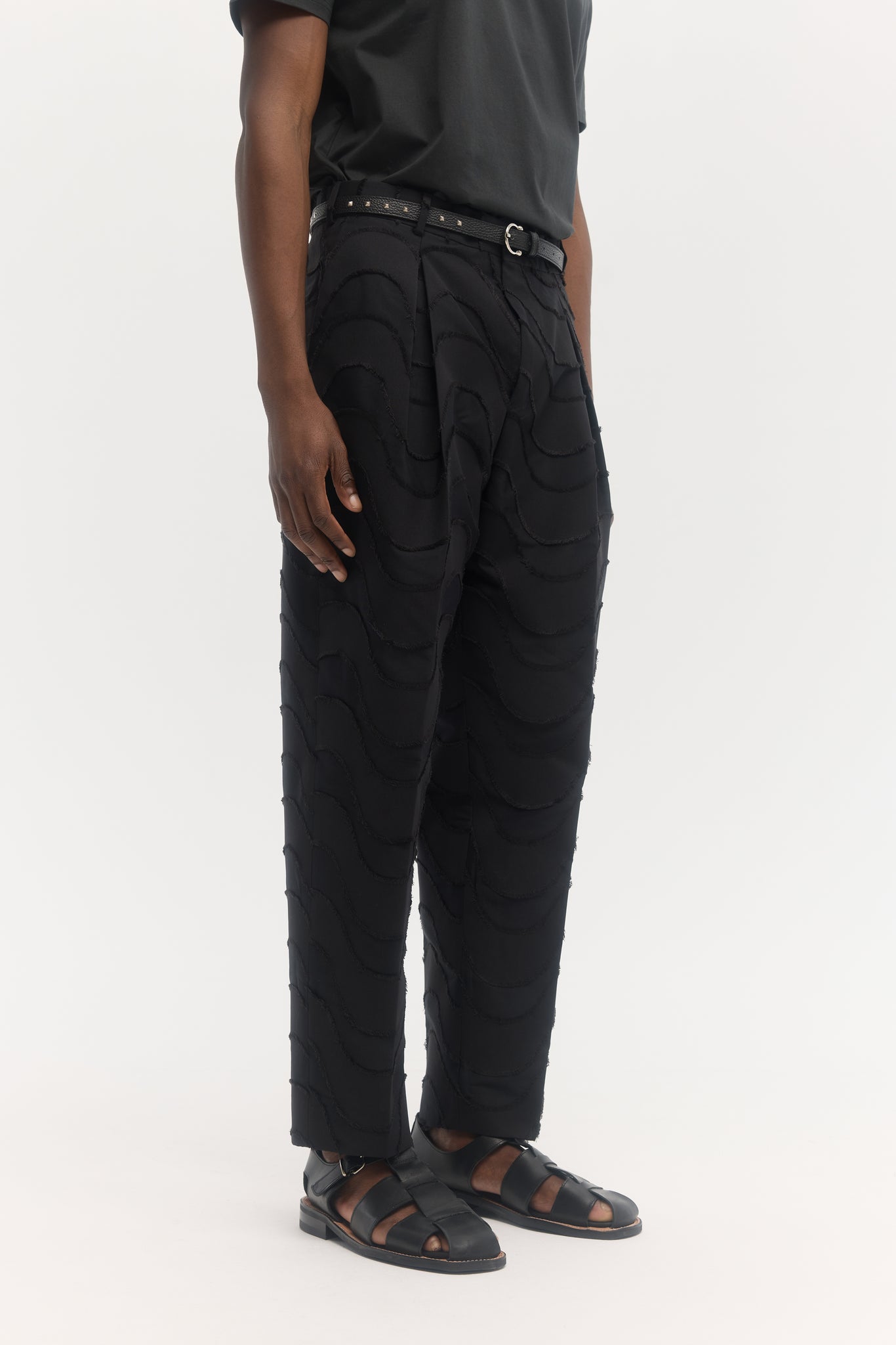 Black wave cut jacquard parachute trousers
